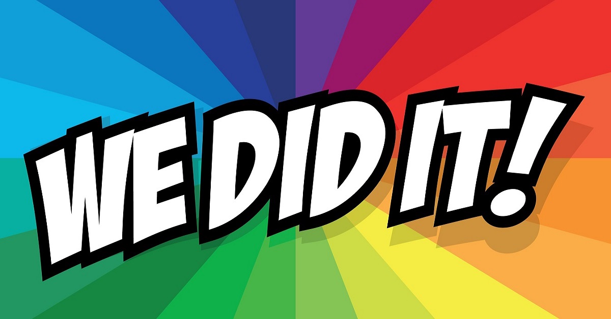 The words 'We Did It' on a colorful background.